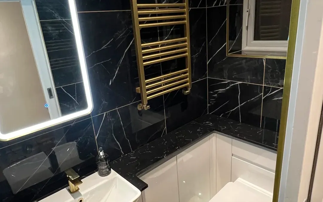 Completed bathroom renovation with tiled walls and a walk-in shower in North Derbyshire