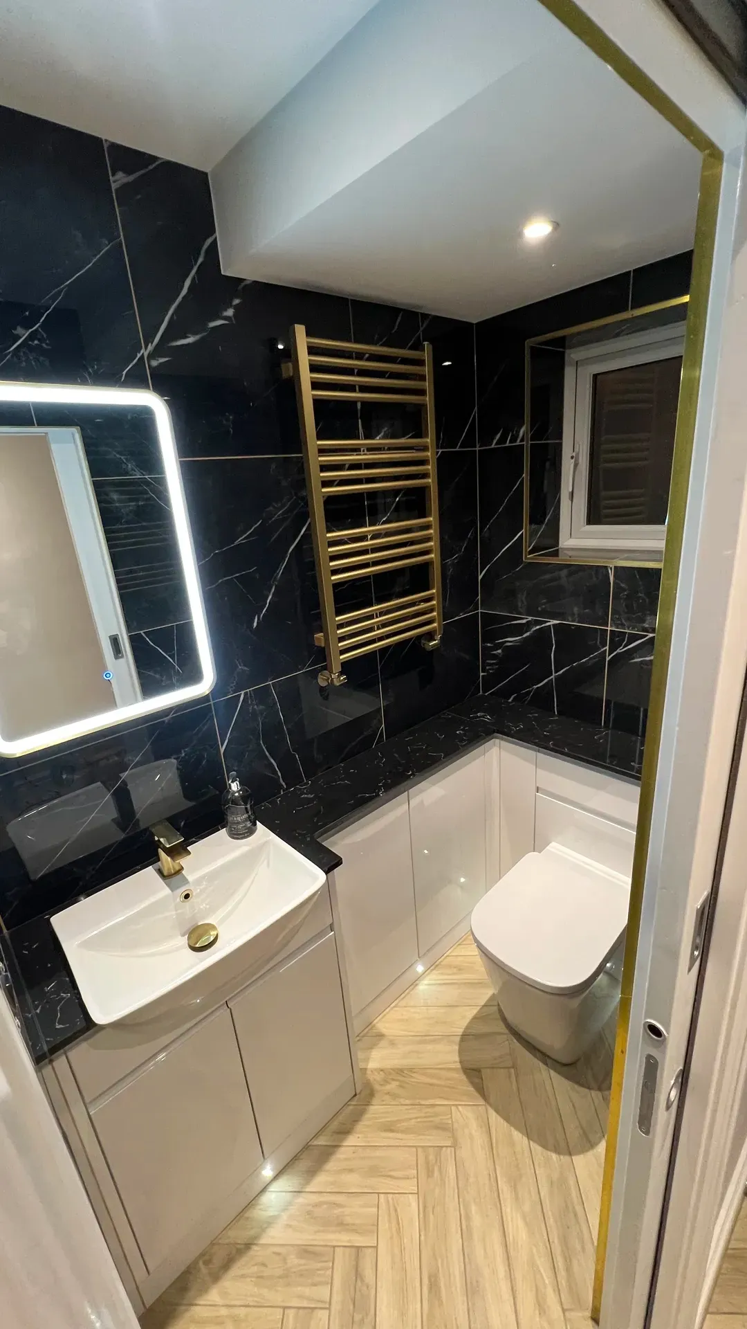 Fitted bathroom with tiled walls and a walk-in shower enclosure completed in North Derbyshire