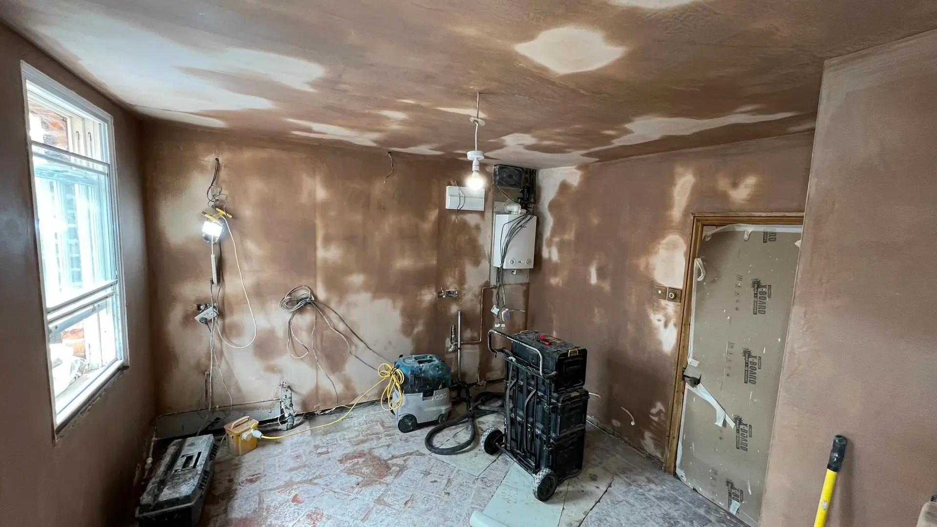 Freshly skimmed plaster walls ready for decorating in a renovated Derbyshire home
