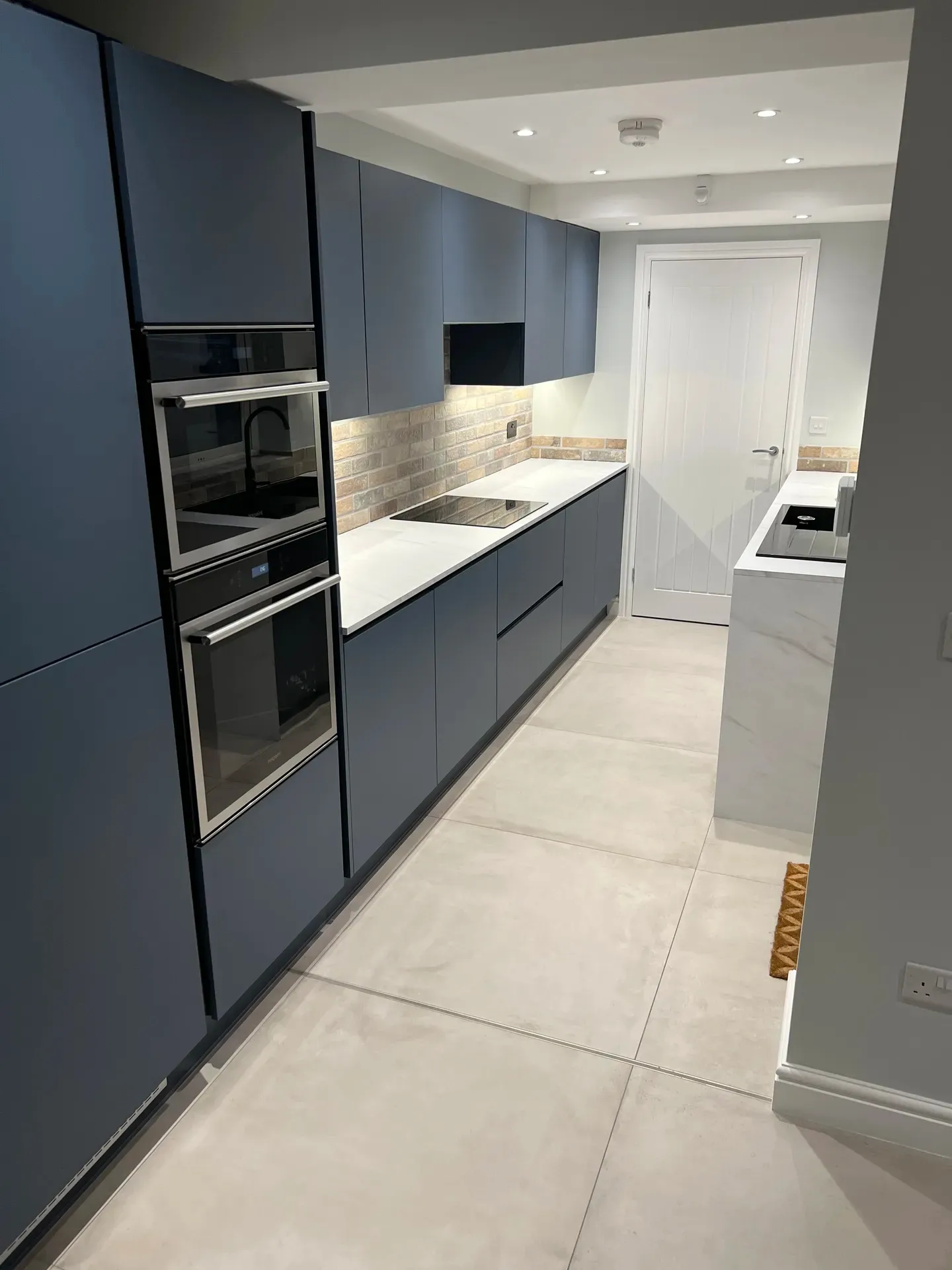 Completed fitted kitchen with modern units and worktops installed in Nottinghamshire